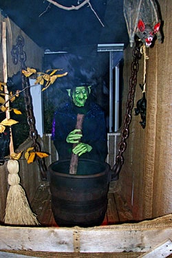 Witch Stirring a Hanging Cauldron